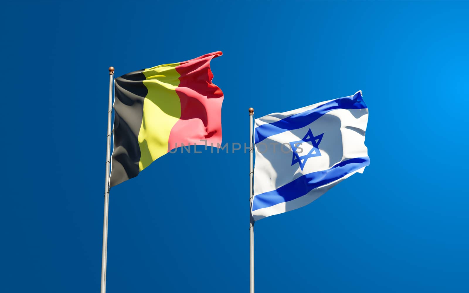 Beautiful national state flags of Israel and Belgium together at the sky background. 3D artwork concept.