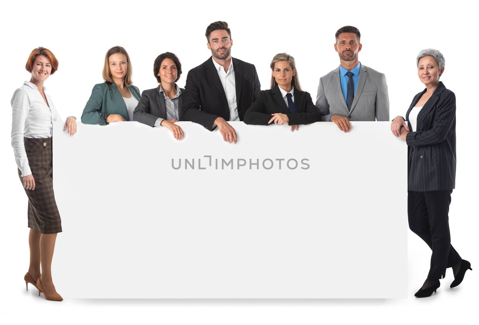 Business people group with blank banner isolated over white