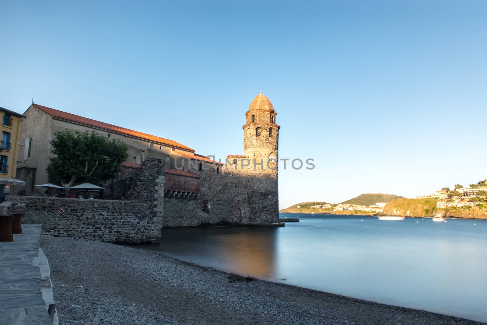 Coliure, France :  2019 Octobre 05 : Beautiful autumn day in the tourist city of Colliure in Occitania whit on back the church of Notre dames des Anges, France.