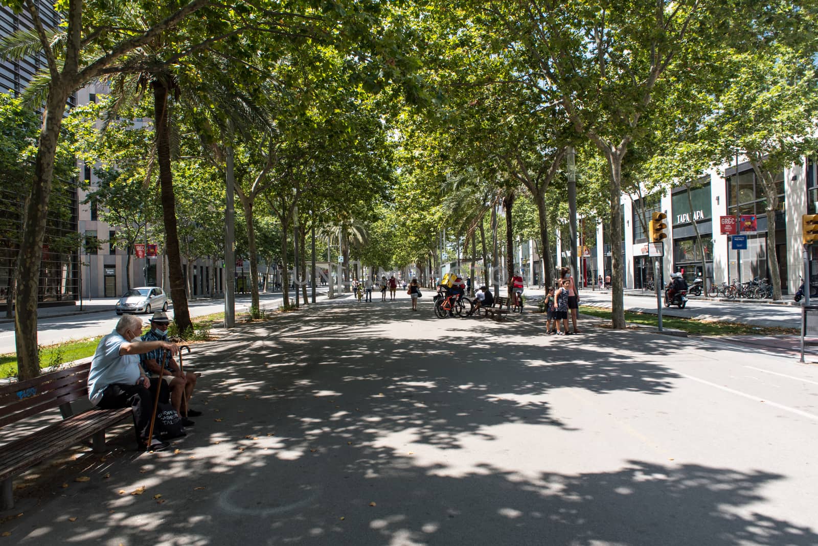 Barcelona, Spain - June 27 2020:  Train behind Glories shopping center is thought to be first shopping centers to have an open plan design incorporating outside space into its layout.