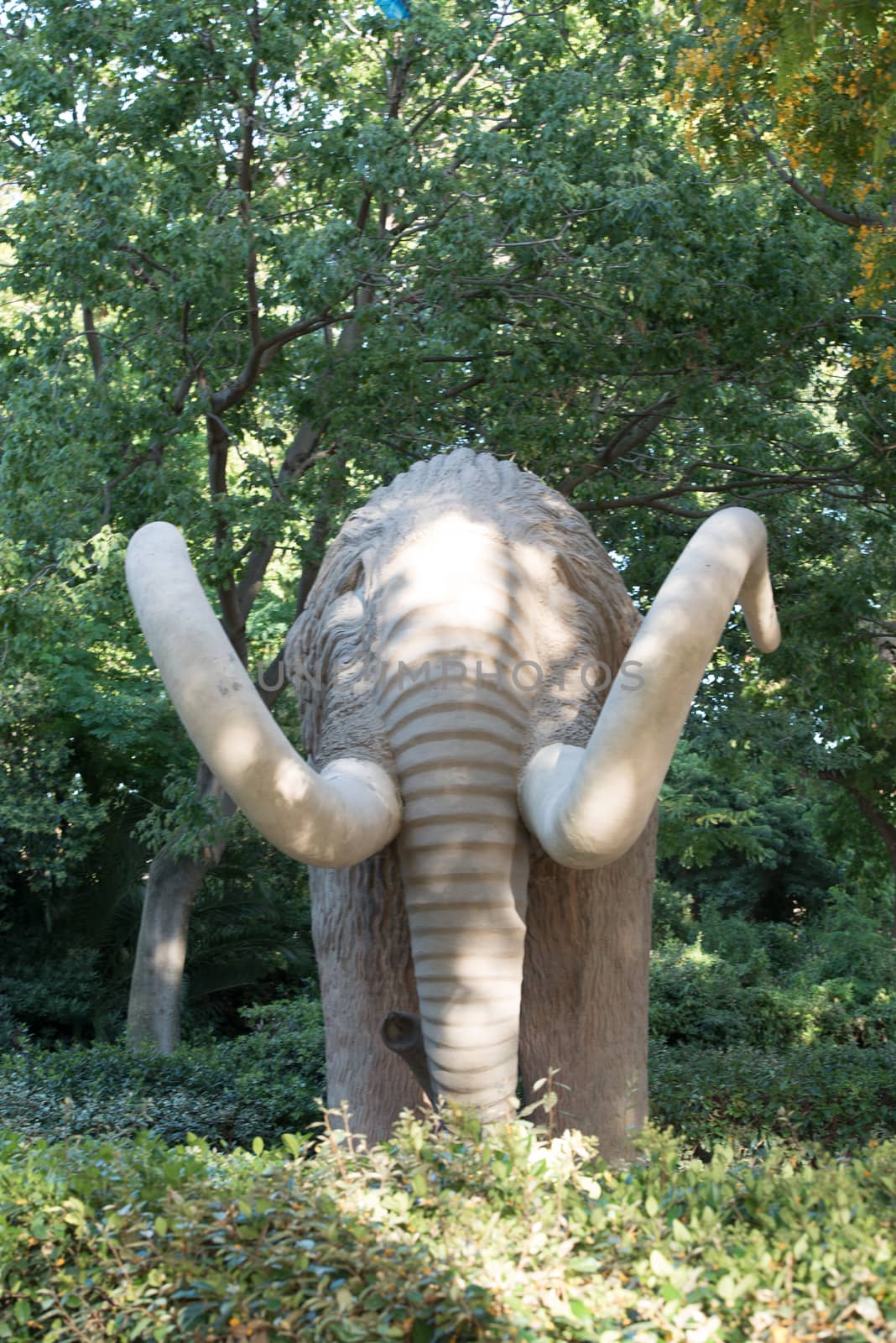 Barcelona, Spain  :  june 26, 2020: These are unidentified visitors near a monument to Mammoth in the Ciutadella Park.