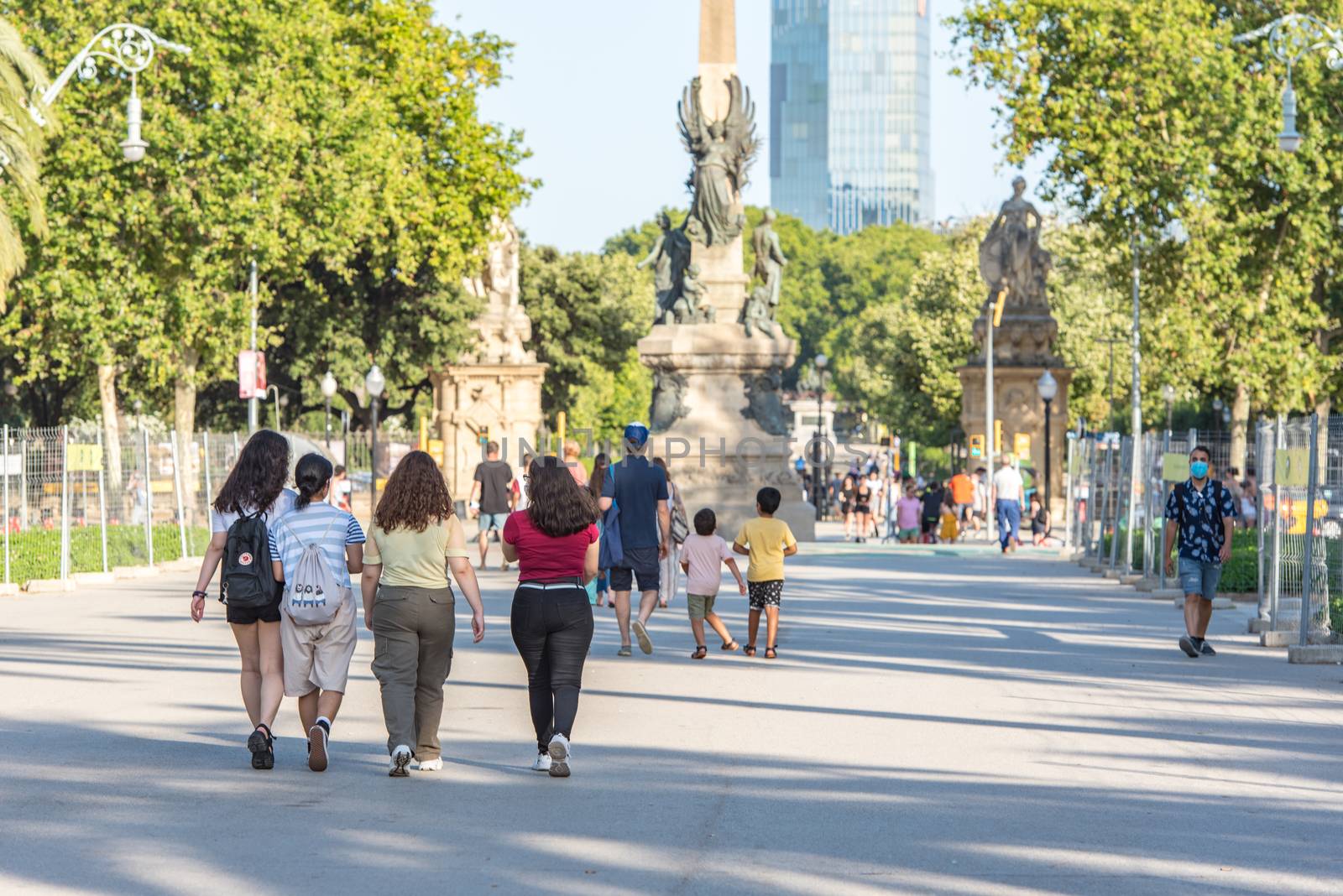 People walk Arc de Triomf landmark in Ciutat Vella district on J by martinscphoto