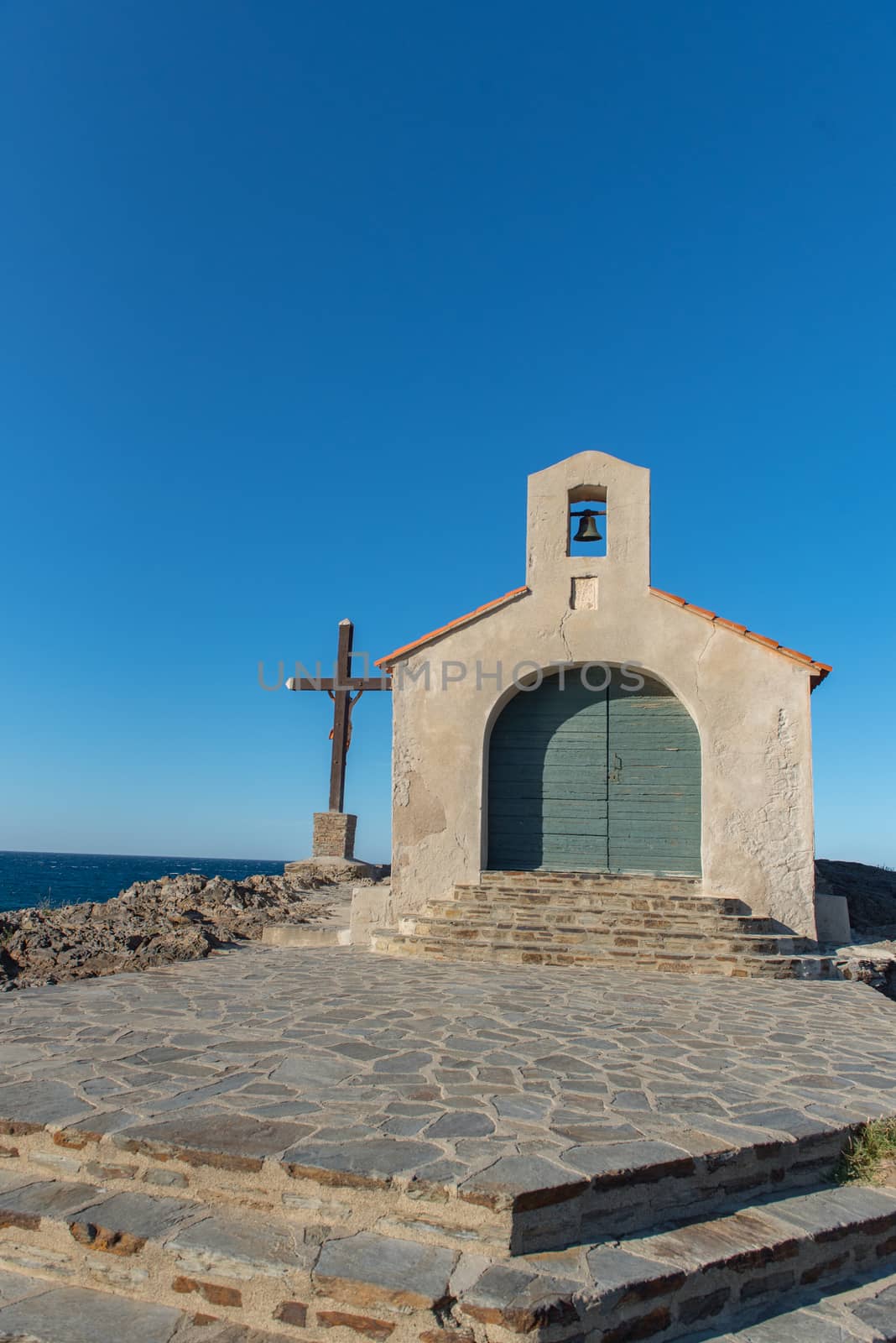 Colioure, France - July 21, 2020: Tourists near chapel of Saint Vincent in sea of Collioure in south of France.