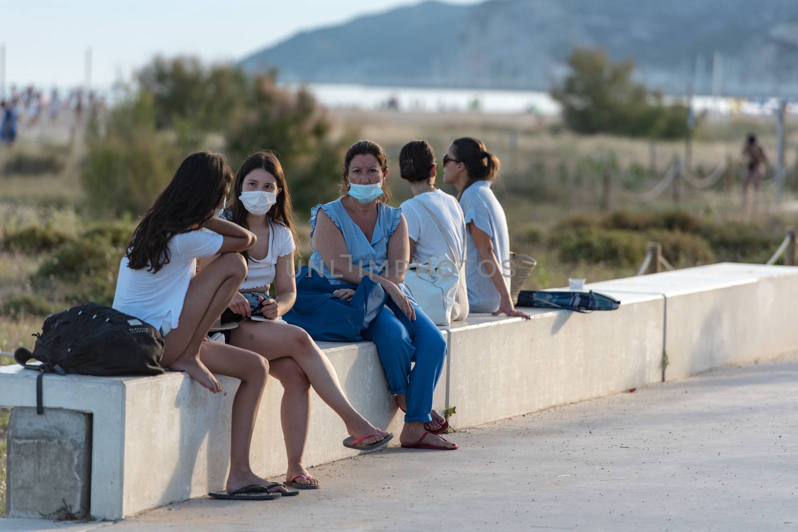 Castelldefels, Spain: 2020 June 25: People walk in the coastline of Castelldefels in Barcelona in summer after COVID 19 on June 2020.