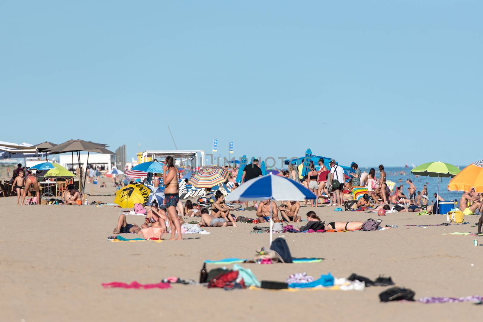 Castelldefels, Spain: 2020 June 25: People in the beach of Castelldefels in Barcelona in summer after COVID 19 on June 2020.