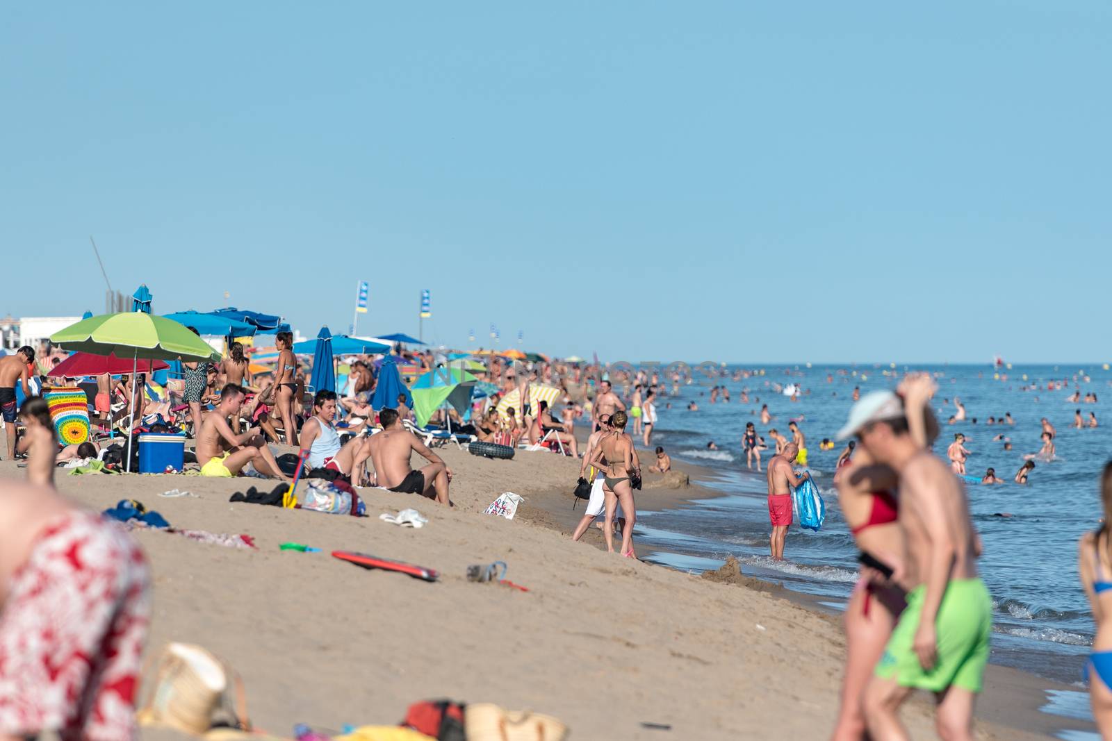 Castelldefels, Spain: 2020 June 25: People in the beach of Castelldefels in Barcelona in summer after COVID 19 on June 2020.