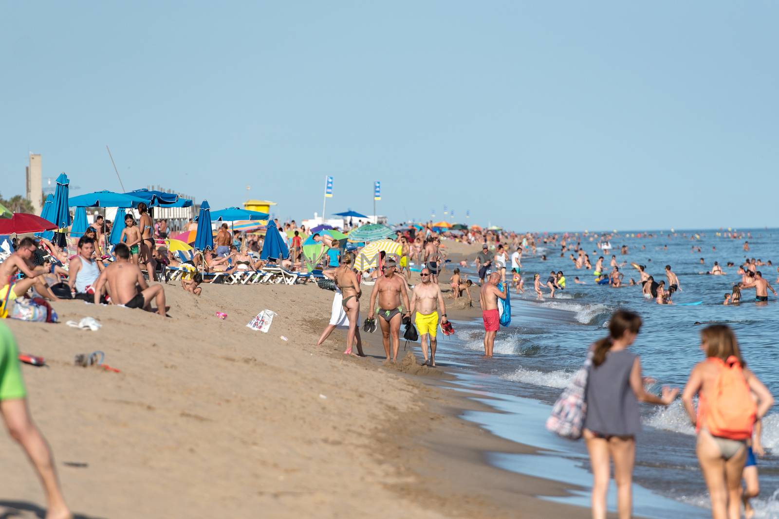 People in the beach of Castelldefels in Barcelona in summer afte by martinscphoto