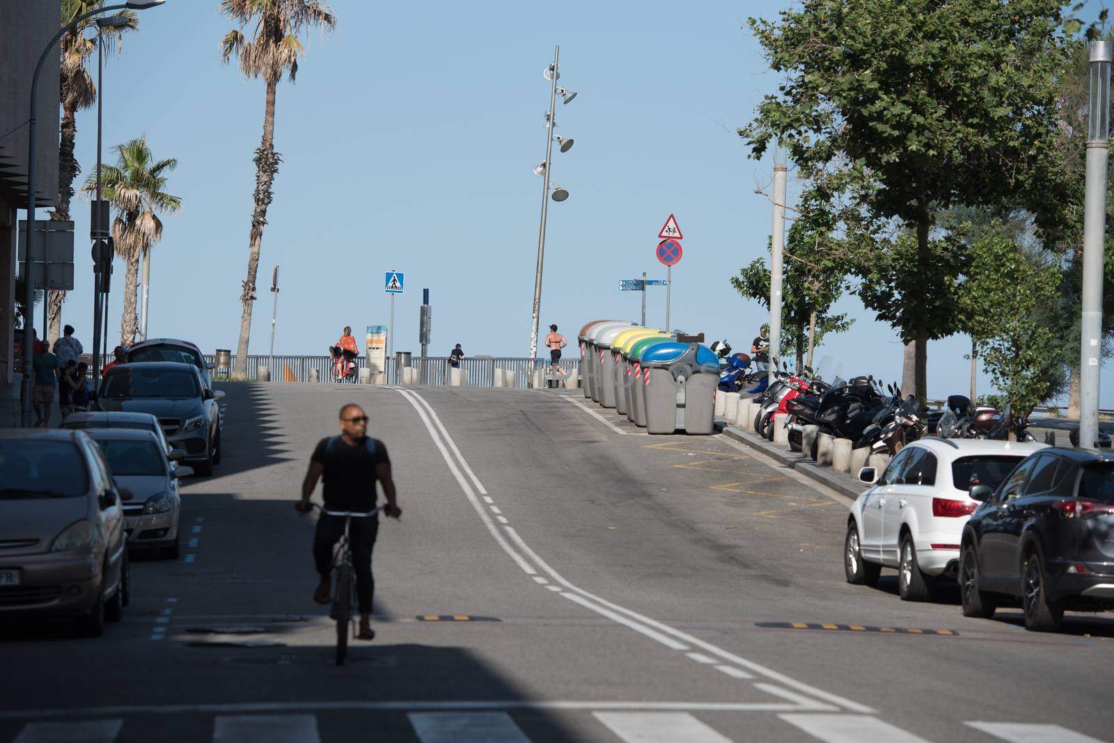 BARCELONA - JUNE 26, 2020: Street on Barceloneta beach with people from Barceloneta after COVID 19 on June 26, 2020 in Barcelona, ​​Spain.