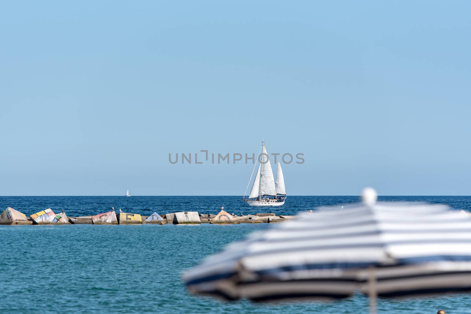 BARCELONA - JUNE 26, 2020: Barceloneta beach with people in summer after COVID 19 on June 26, 2020 in Barcelona, ​​Spain.