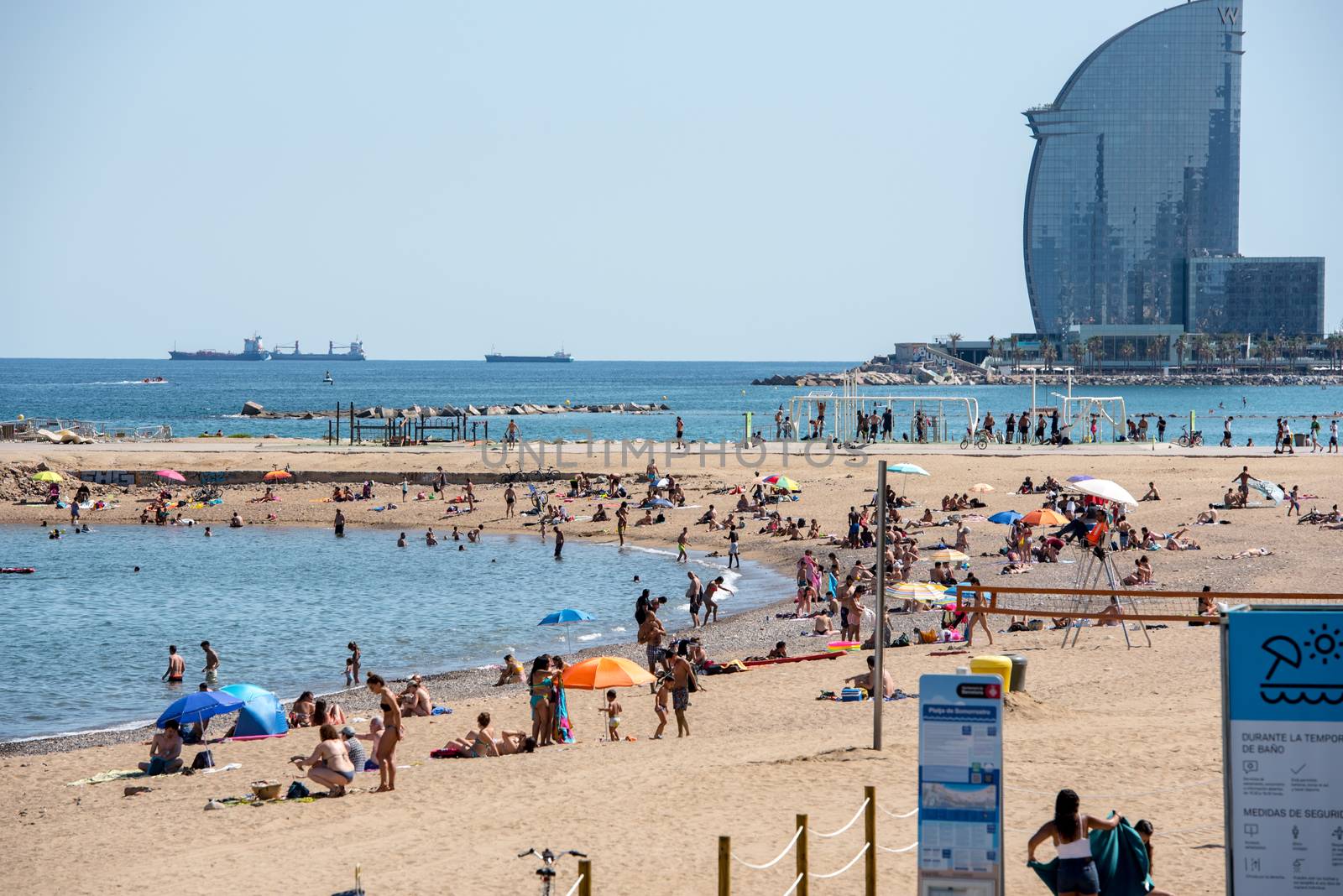 BARCELONA - JUNE 26, 2020: Barceloneta beach with people in summer after COVID 19 on June 26, 2020 in Barcelona, ​​Spain.