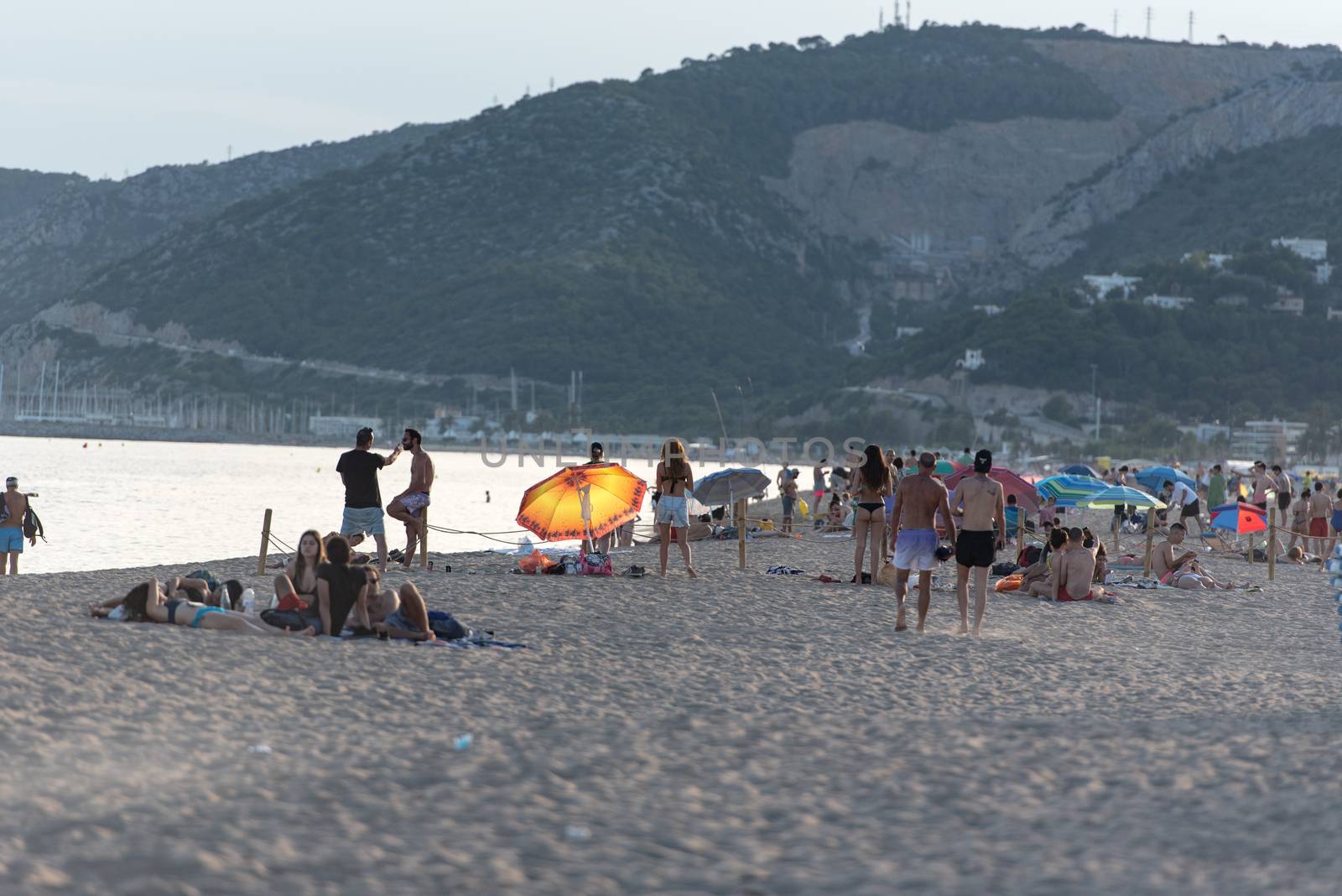 People in the beach of Castelldefels in Barcelona in summer afte by martinscphoto