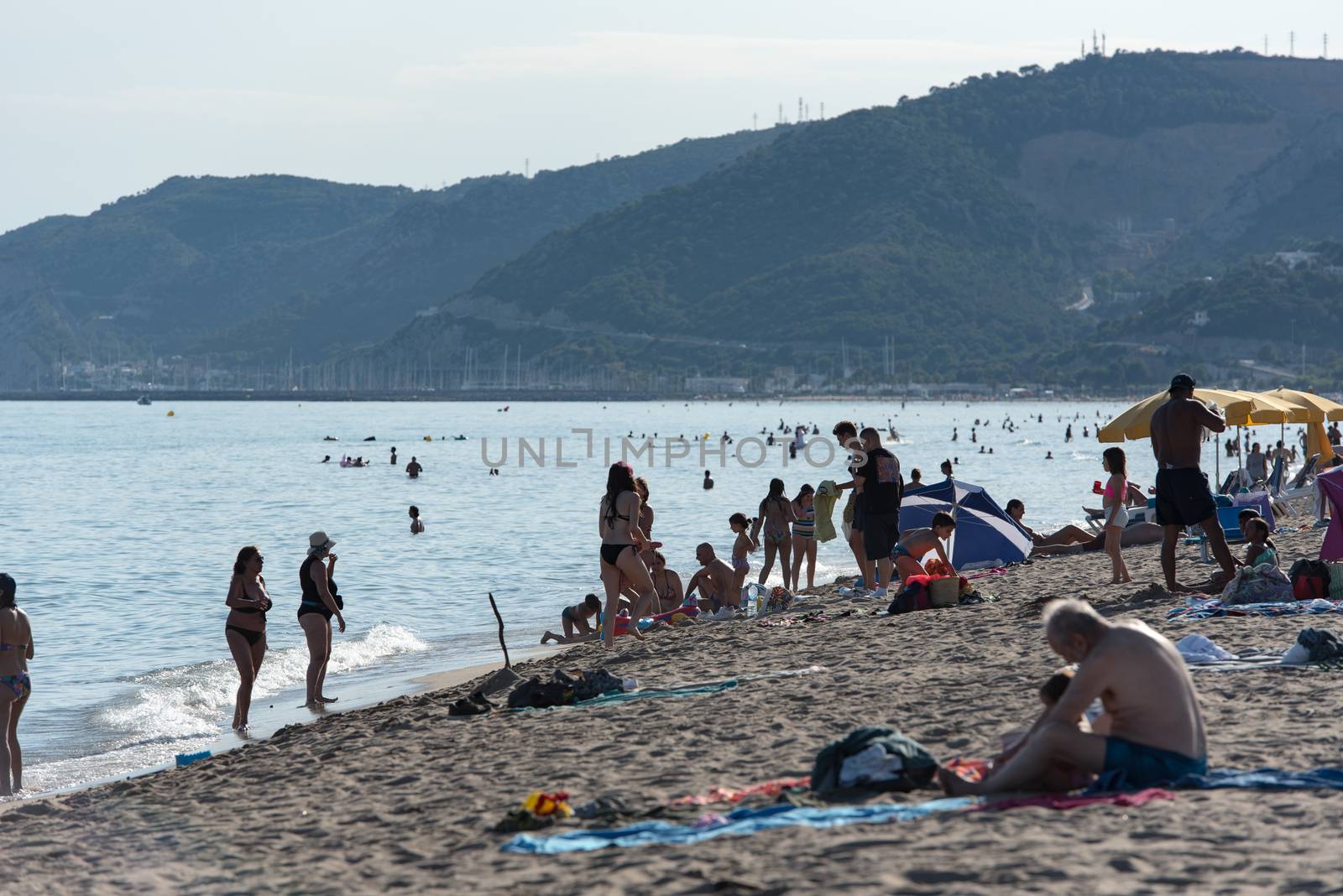 People in the beach of Castelldefels in Barcelona in summer afte by martinscphoto