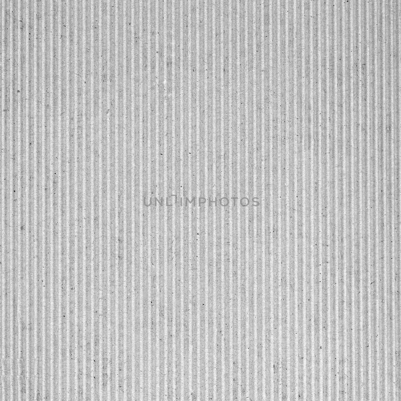 white corrugated cardboard texture background by claudiodivizia