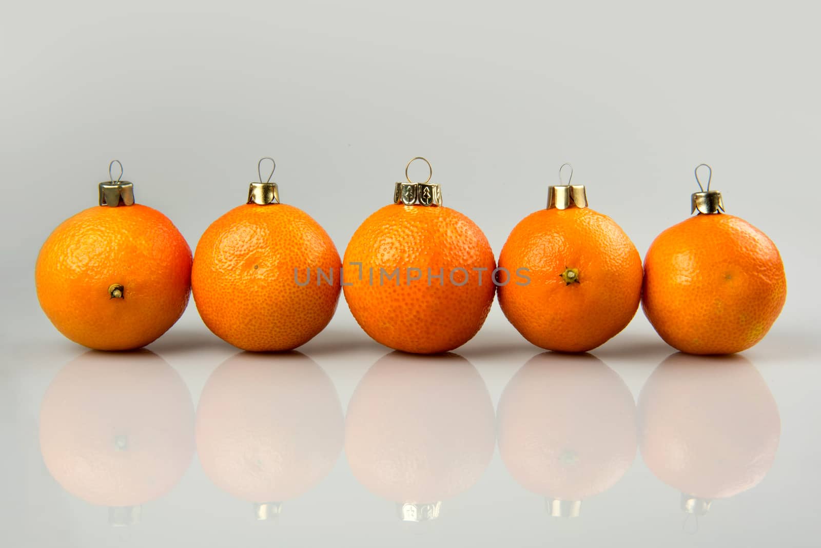 Tangerines as a xmas ball on Christmas and New Year. Russian tradition fir tree toy fruits holiday concept decoration design on holiday.