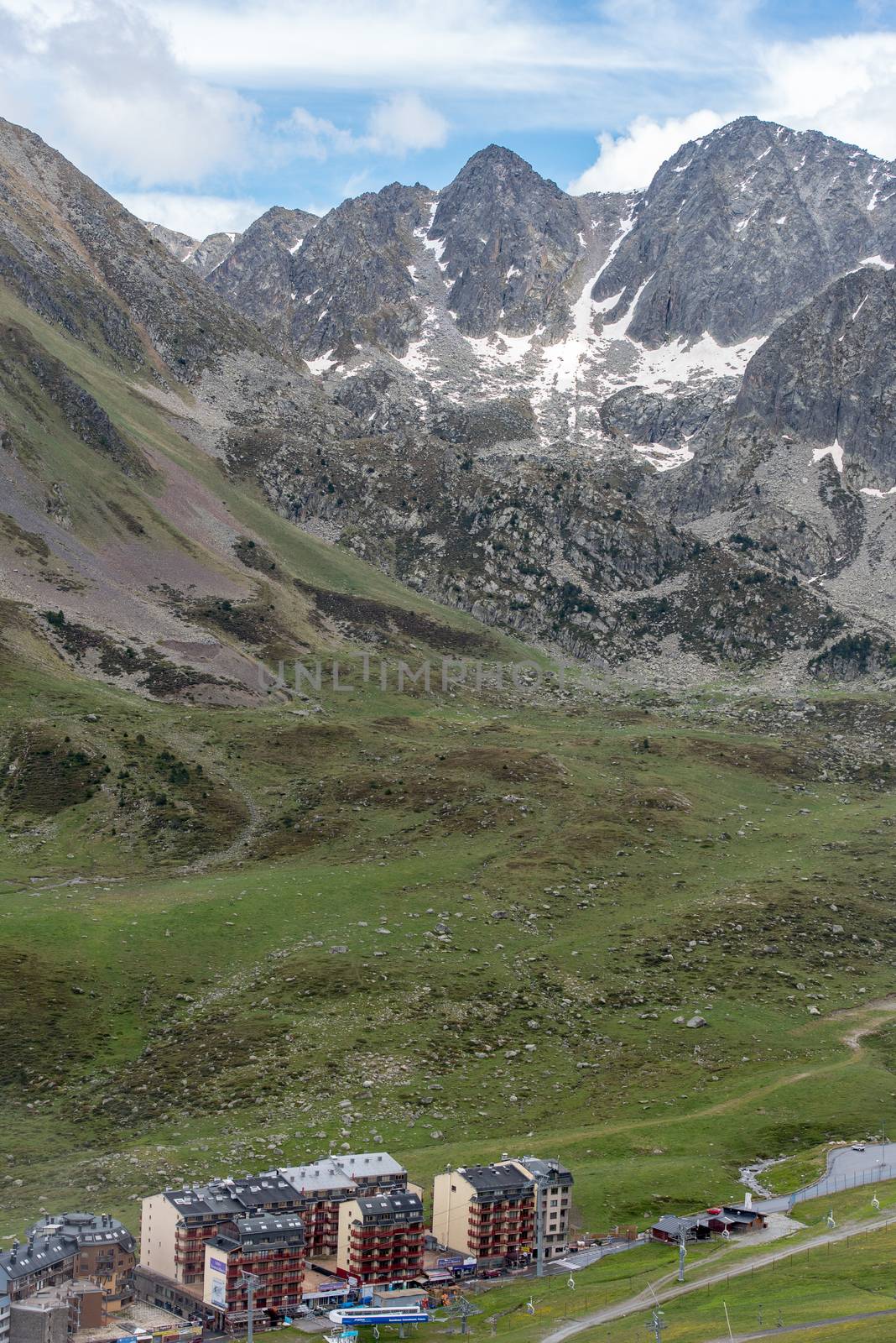 Pas de la Casa, Encamp. Andorra : 2020 17 June : Sunny day with low clouds in the town of Pas de la Casa on the border between Frace and Andorra in June 2020.