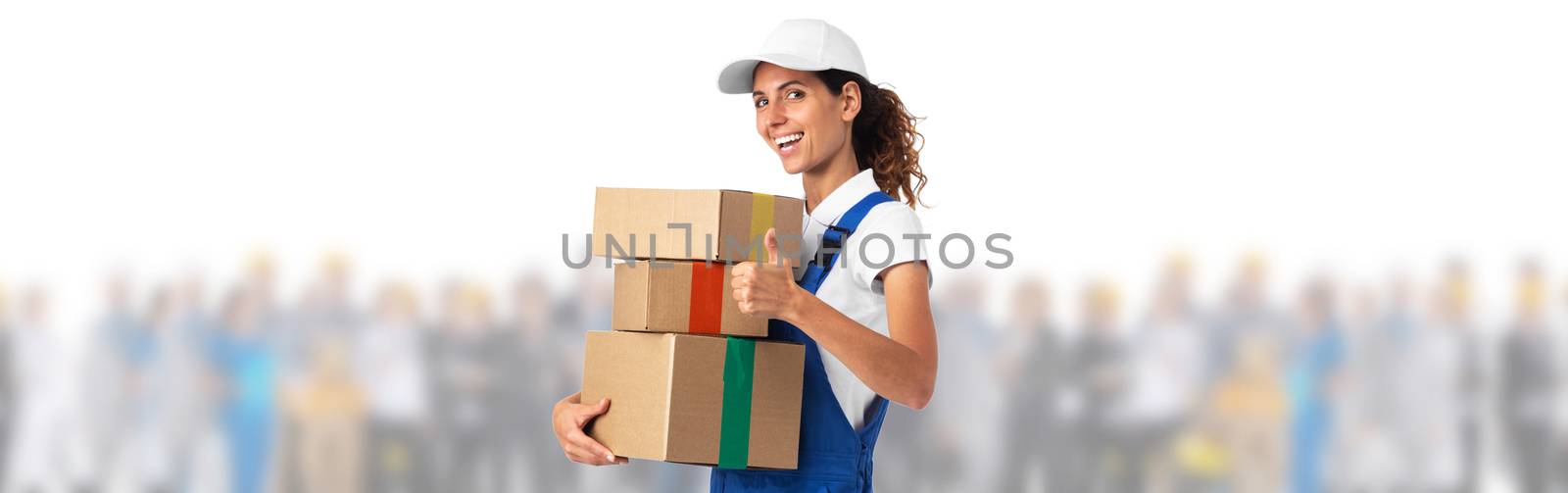 Young delivery brunette girl with thumbs up over many customers people isolated white background