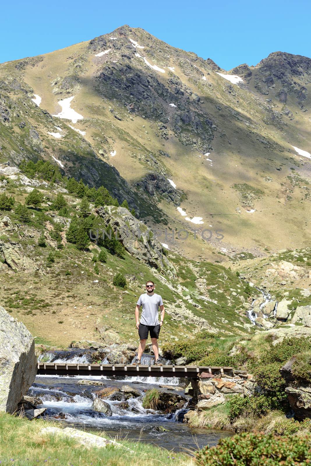 Ordino, Andorra : 2020 may 29 : Young men in the Beautiful view hiking in the Andorra Pyrenees Mountains in Ordino, near the Lakes of Tristaina.