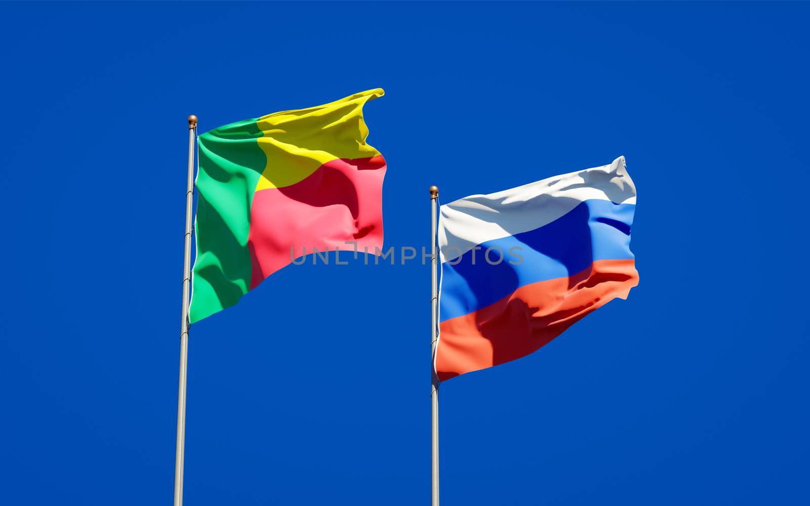 Beautiful national state flags of Russia and Benin together at the sky background. 3D artwork concept. 