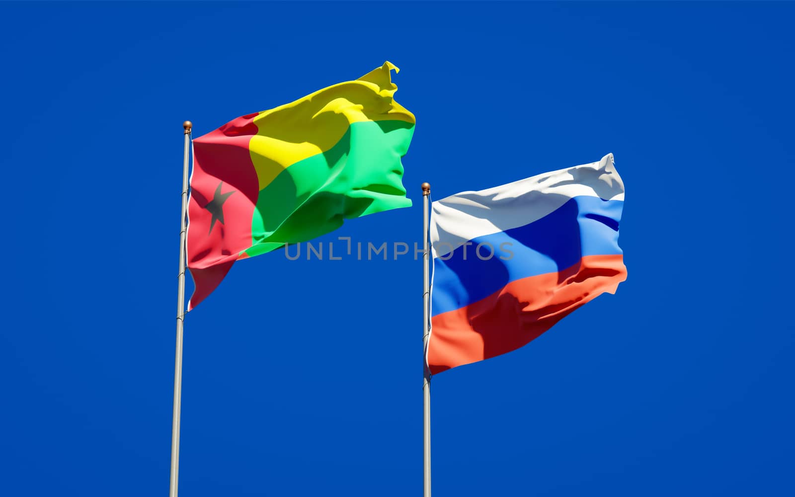 Beautiful national state flags of Russia and Guinea-Bissau together at the sky background. 3D artwork concept. 