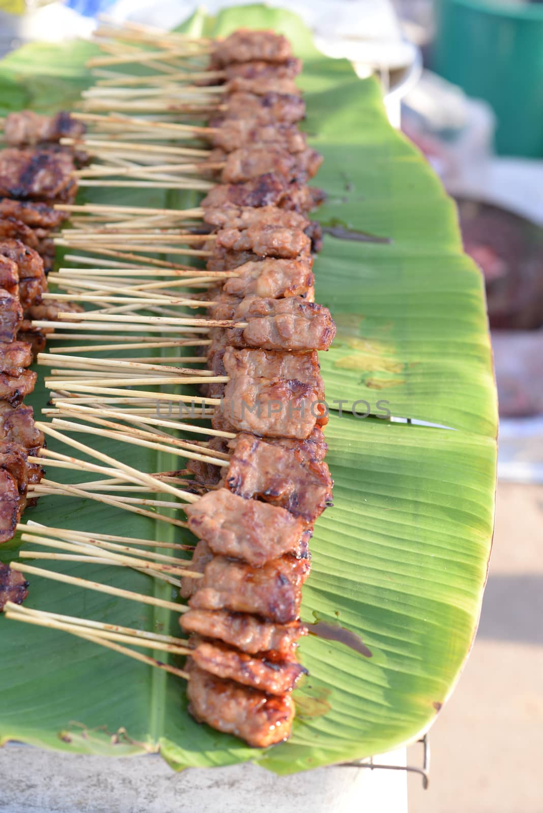 Grilled pork, also known as pork barbecue Stacked on a banana leaf