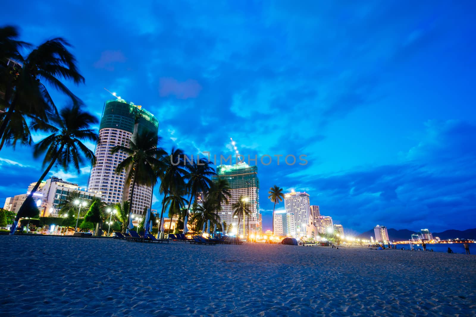 Nha Trang, Vietnam - September 25, 2018: The promenade and main beach of Nha Trang on a warm September evening as the sun sets