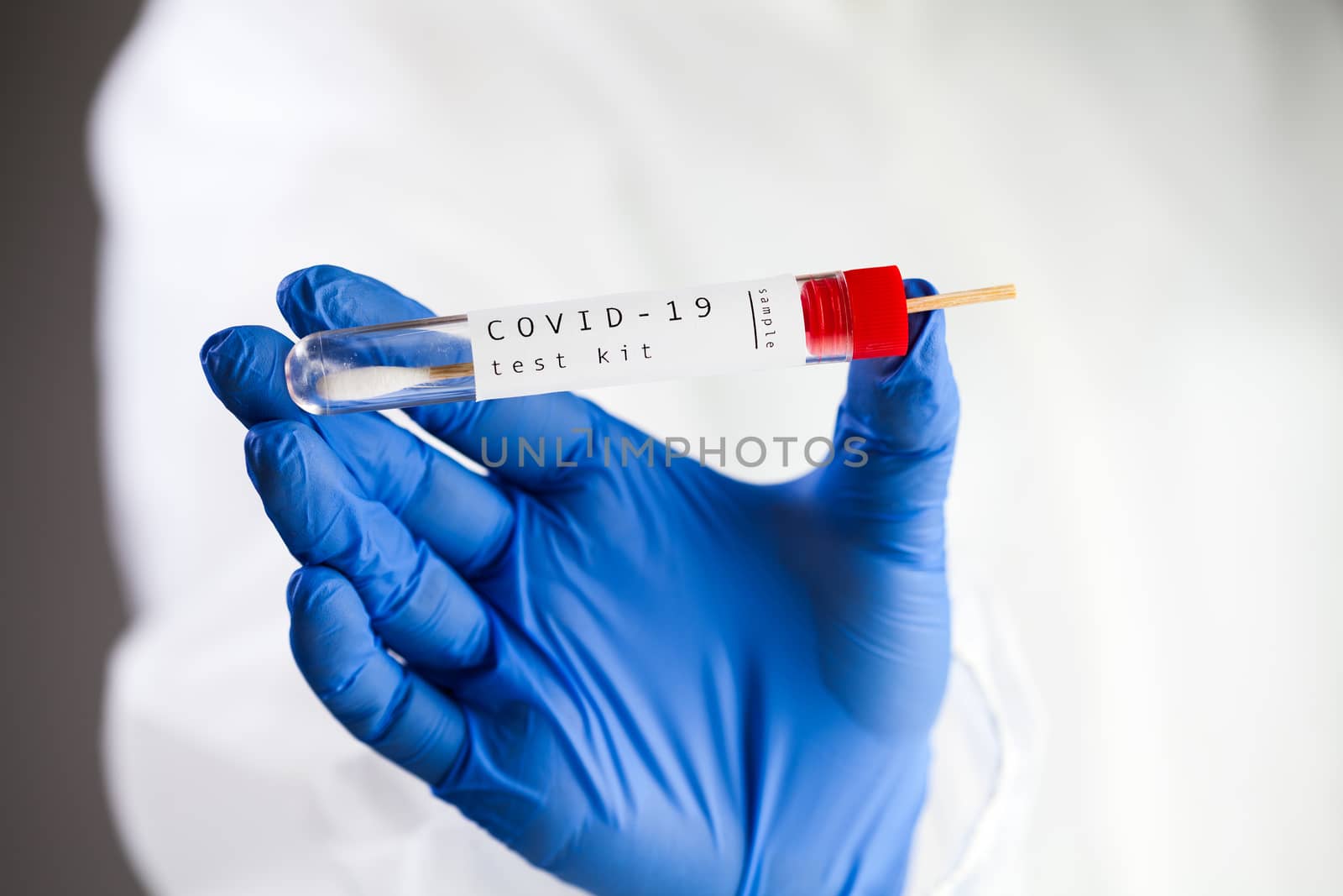 COVID-19 virus disease self swab test sample kit, medical laboratory scientist holding a test tube with throat swab viral specimen collection equipment, Coronavirus health check 