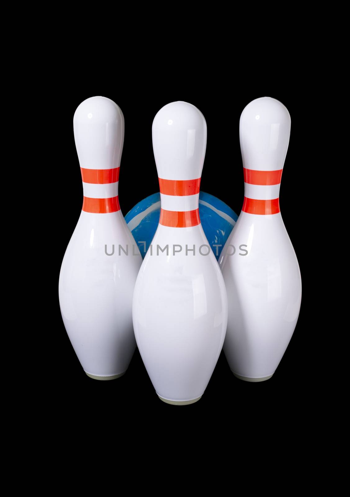Bowling pins of white color isolated on black background. Green bowling ball.