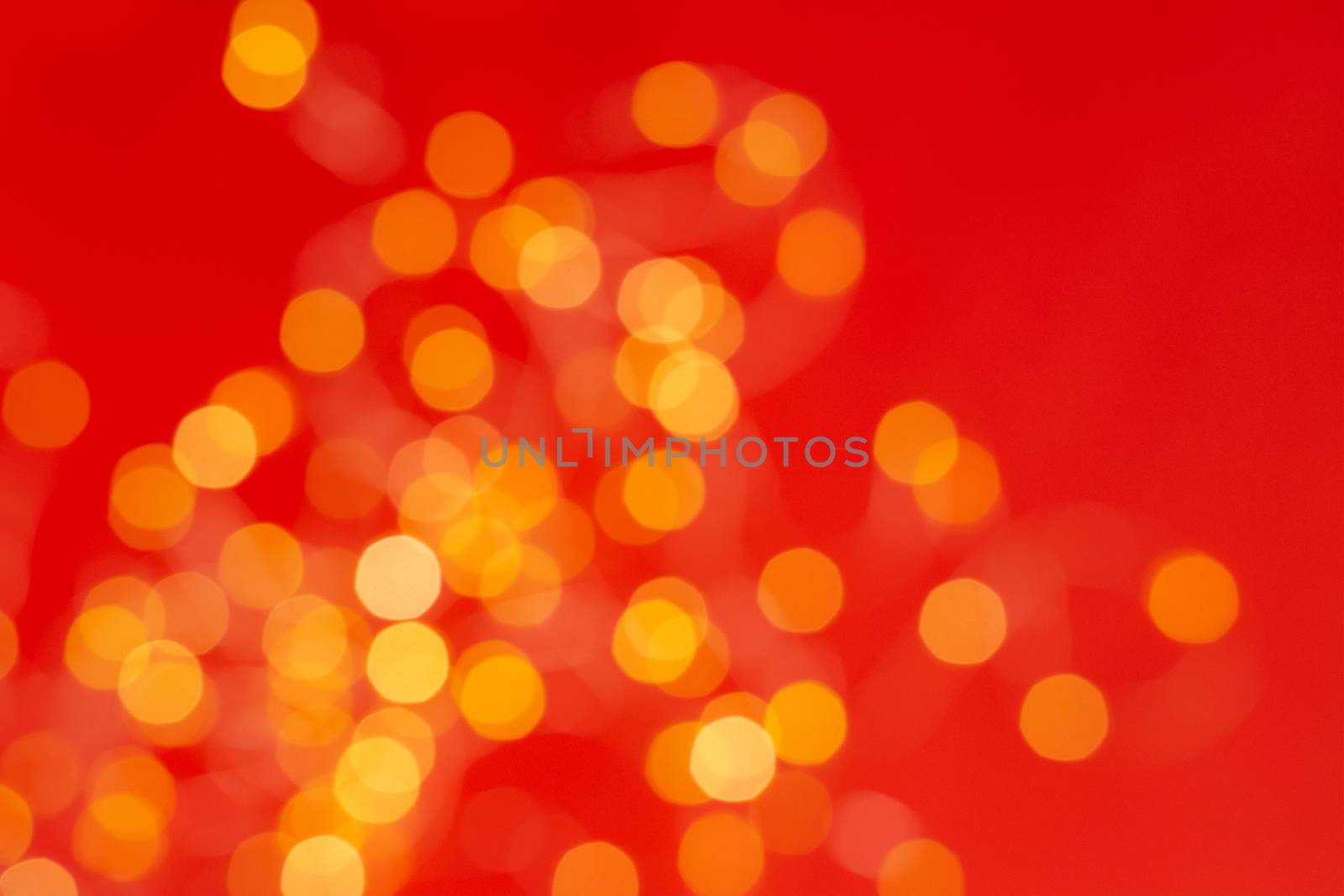 Christmas holiday background with festive bokeh on red background. Ready-to-install products. blur and bokeh. holiday blur lights. copy space. space for text.