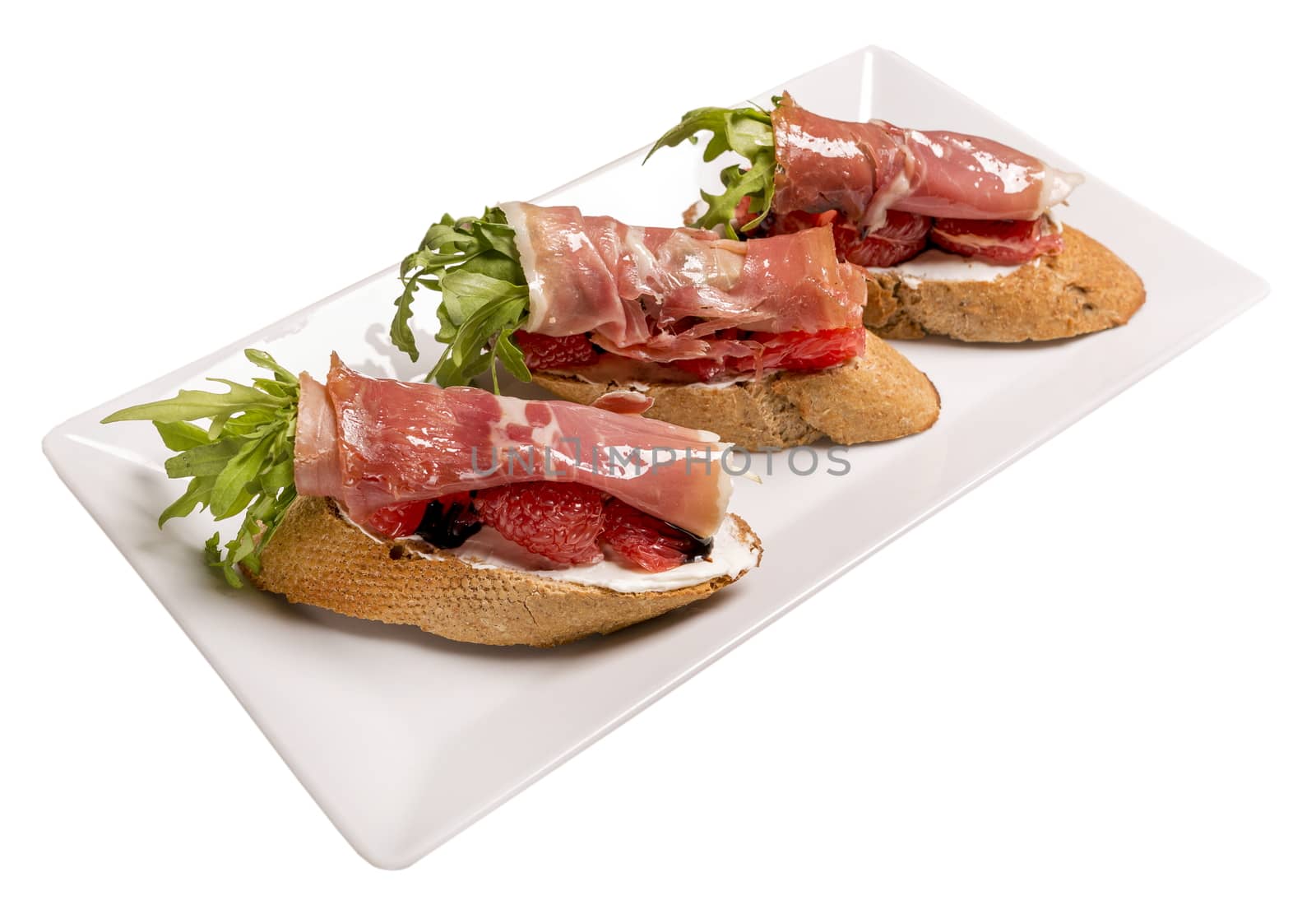 Bruschettes with jamon and grapefruit. Isolated image on white background. by 977_ReX_977
