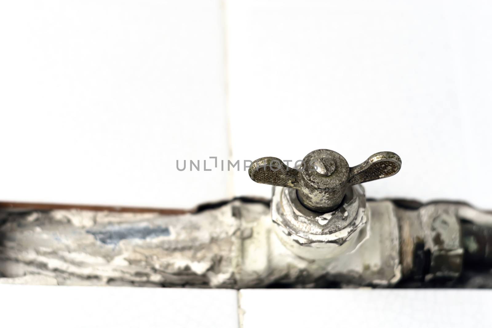 a worn ball valve with a rusty throttle valve. Safety valve to open or close the gas or water flow