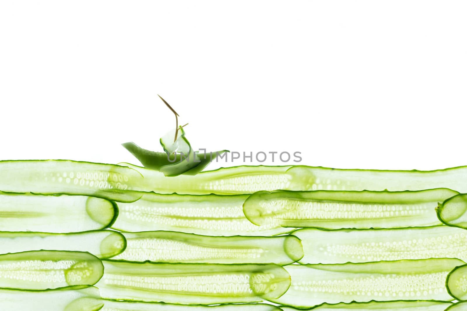 fresh sliced cucumber isolated on white background. Top view by sashokddt