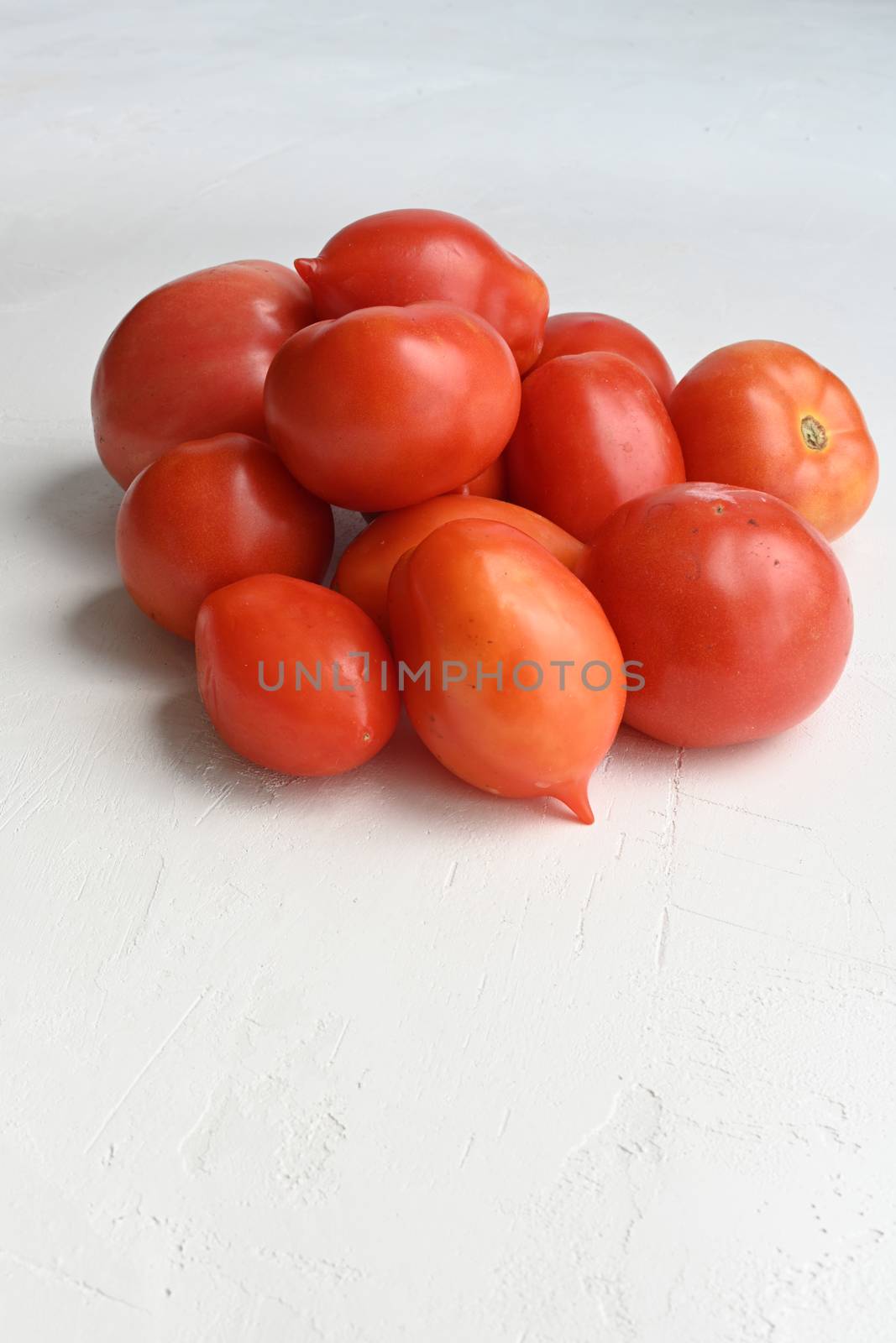 Blurred image of a red tomato on a white background by sashokddt