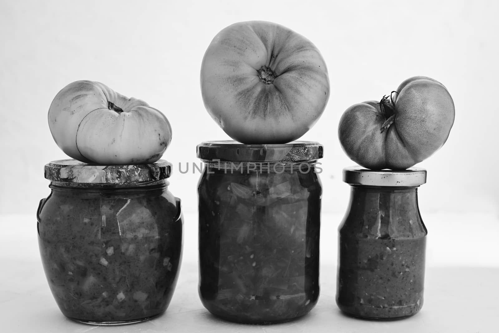 Homemade pickled vegetables. Healthy fermented food. garden vegetables. yellow tomatoes. Black and White. by sashokddt