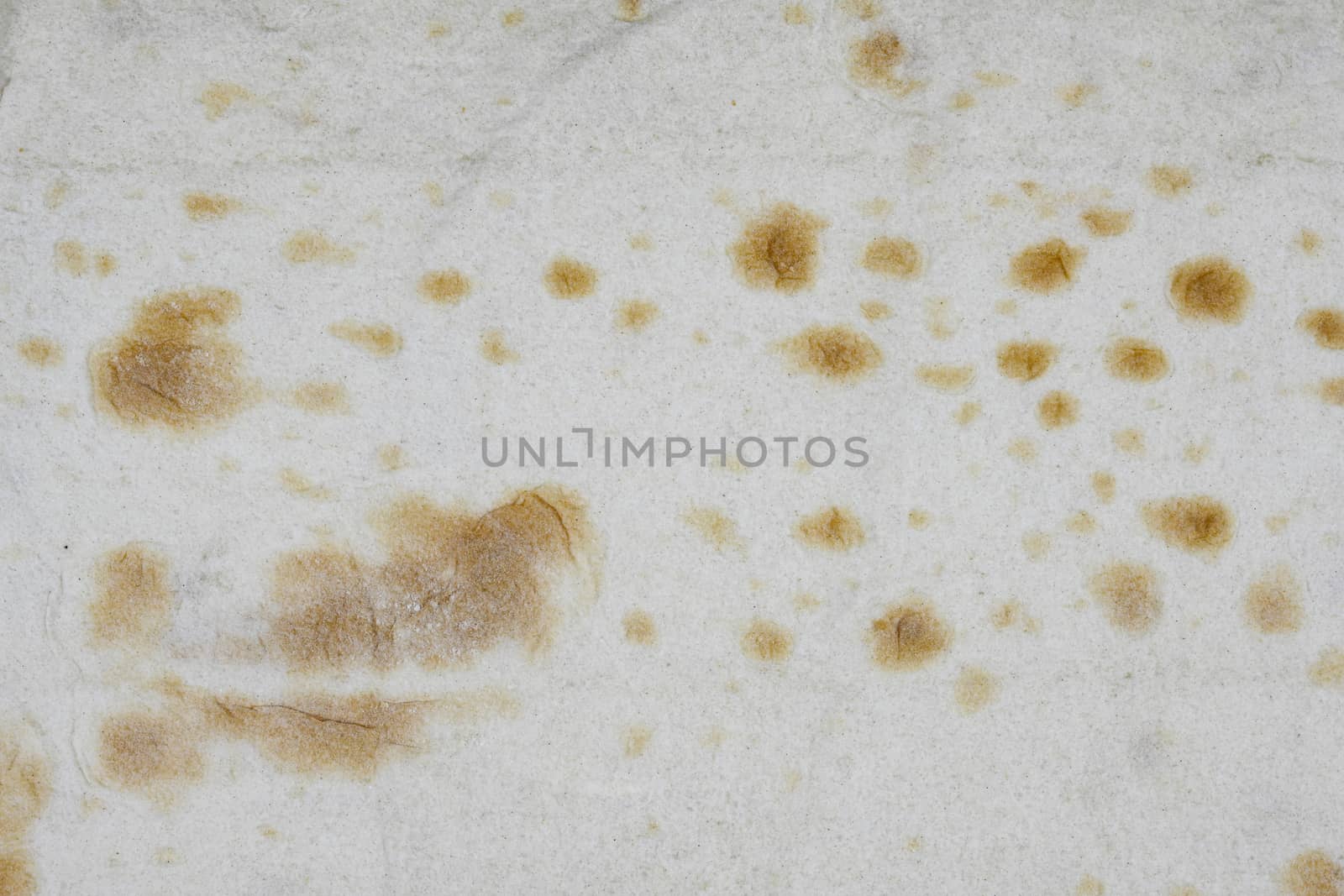 Texture of thin traditional freshly baked homemade oriental bread. Close-up Armenian pita bread - lavash as a textured bread background