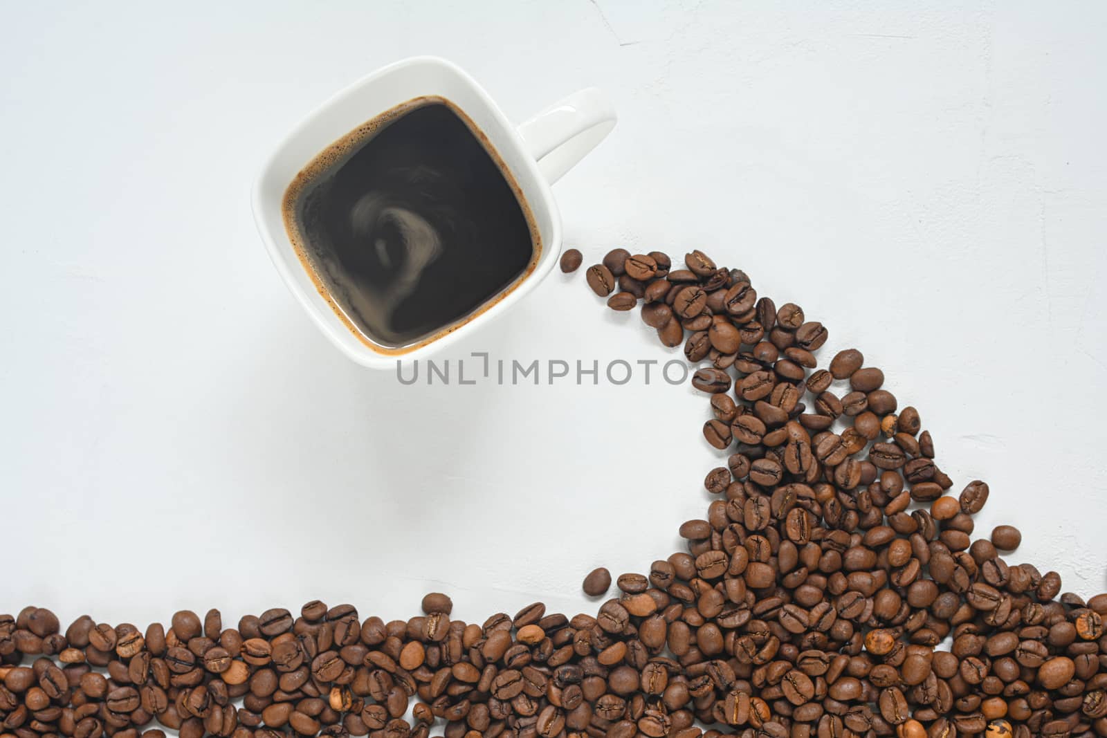 Coffee cup and coffee beans on white background