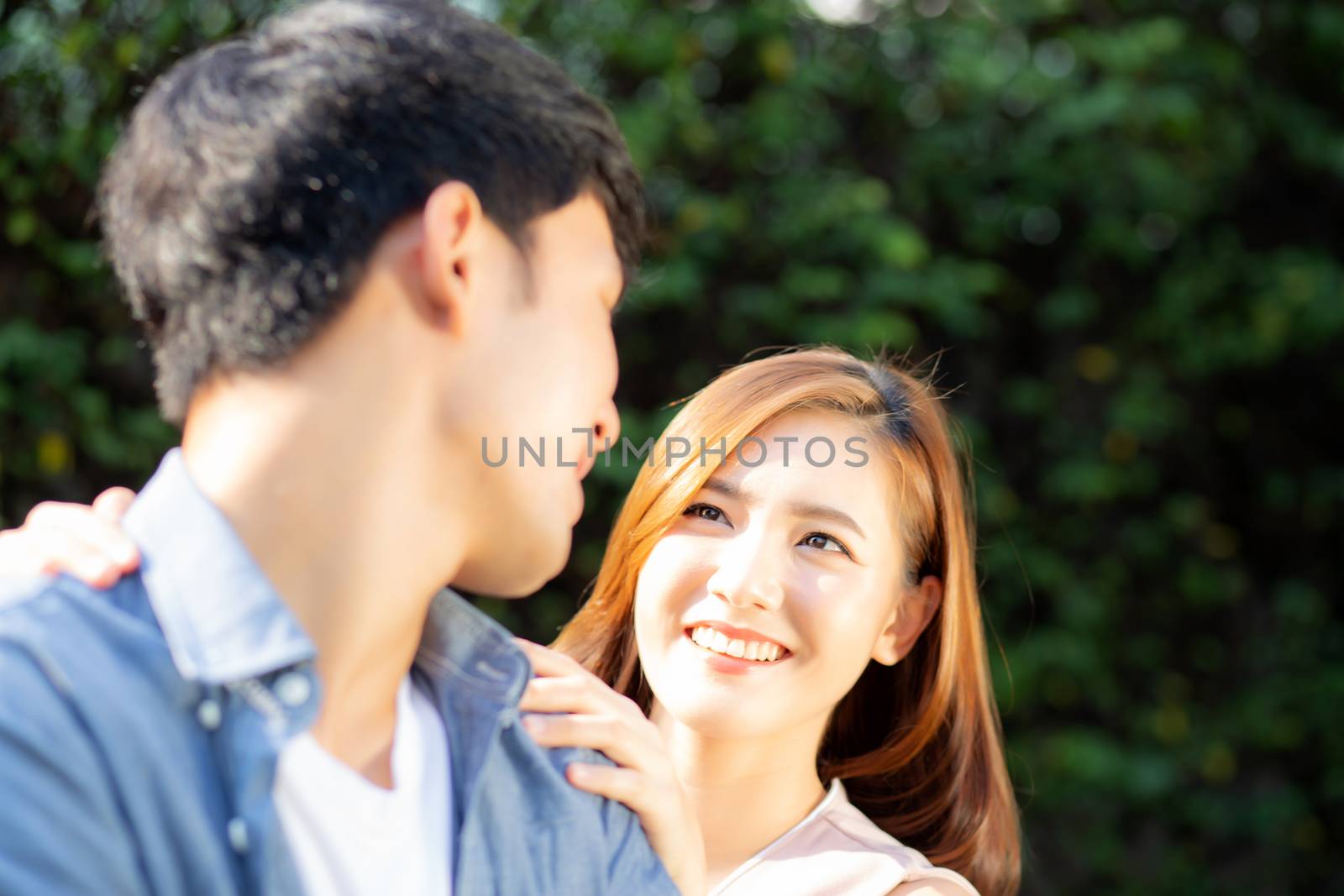 Beautiful portrait couple looking each others eyes and smiling w by nnudoo