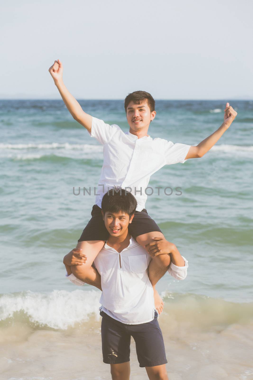 Homosexual portrait young asian couple riding the neck together  by nnudoo
