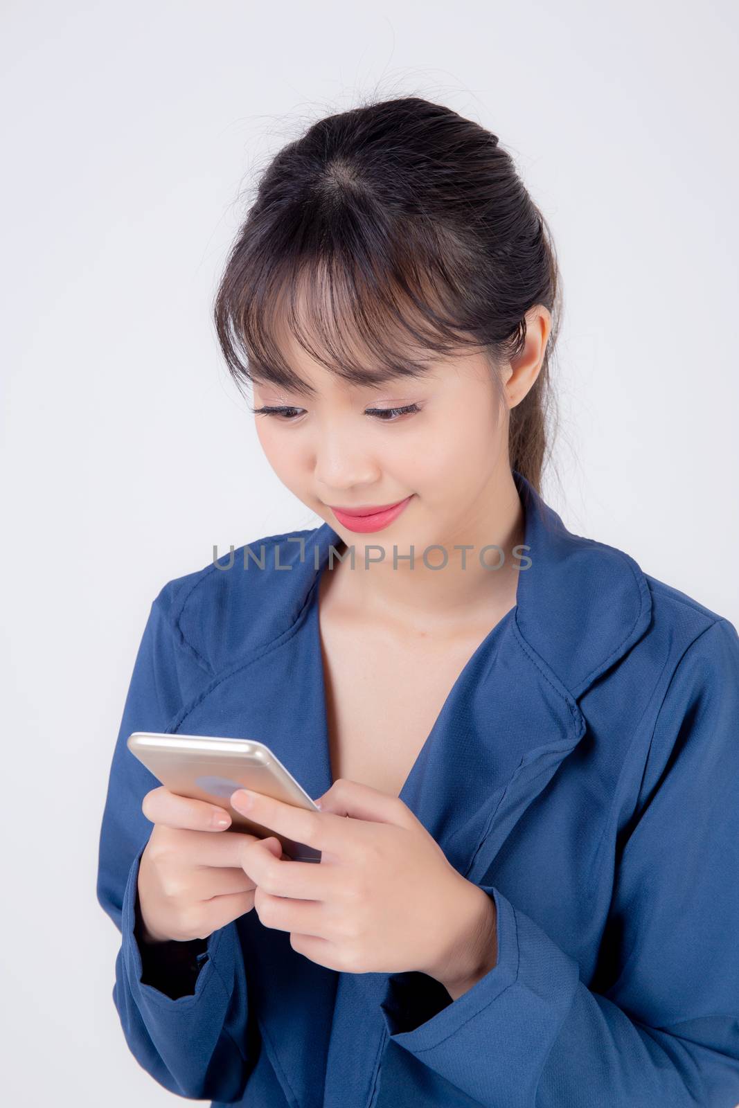 Beautiful portrait young business asian woman using smartphone isolated on white background, businesswoman looking and touch smart mobile phone on social media communication and technology concept.