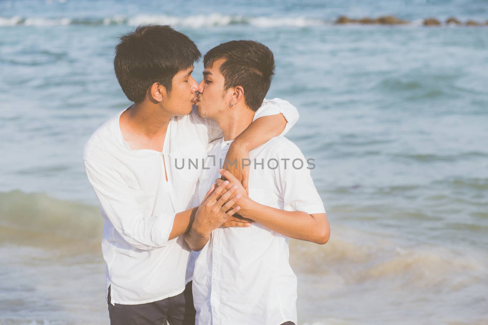 Homosexual portrait young asian couple standing hug and kiss mou by nnudoo