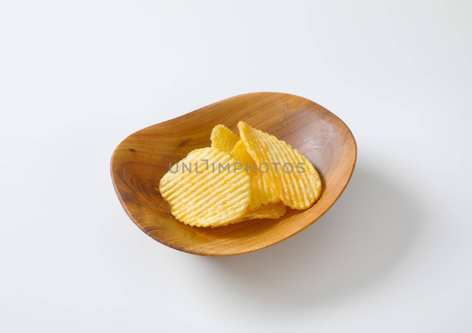Bowl of thin ridged potato chips