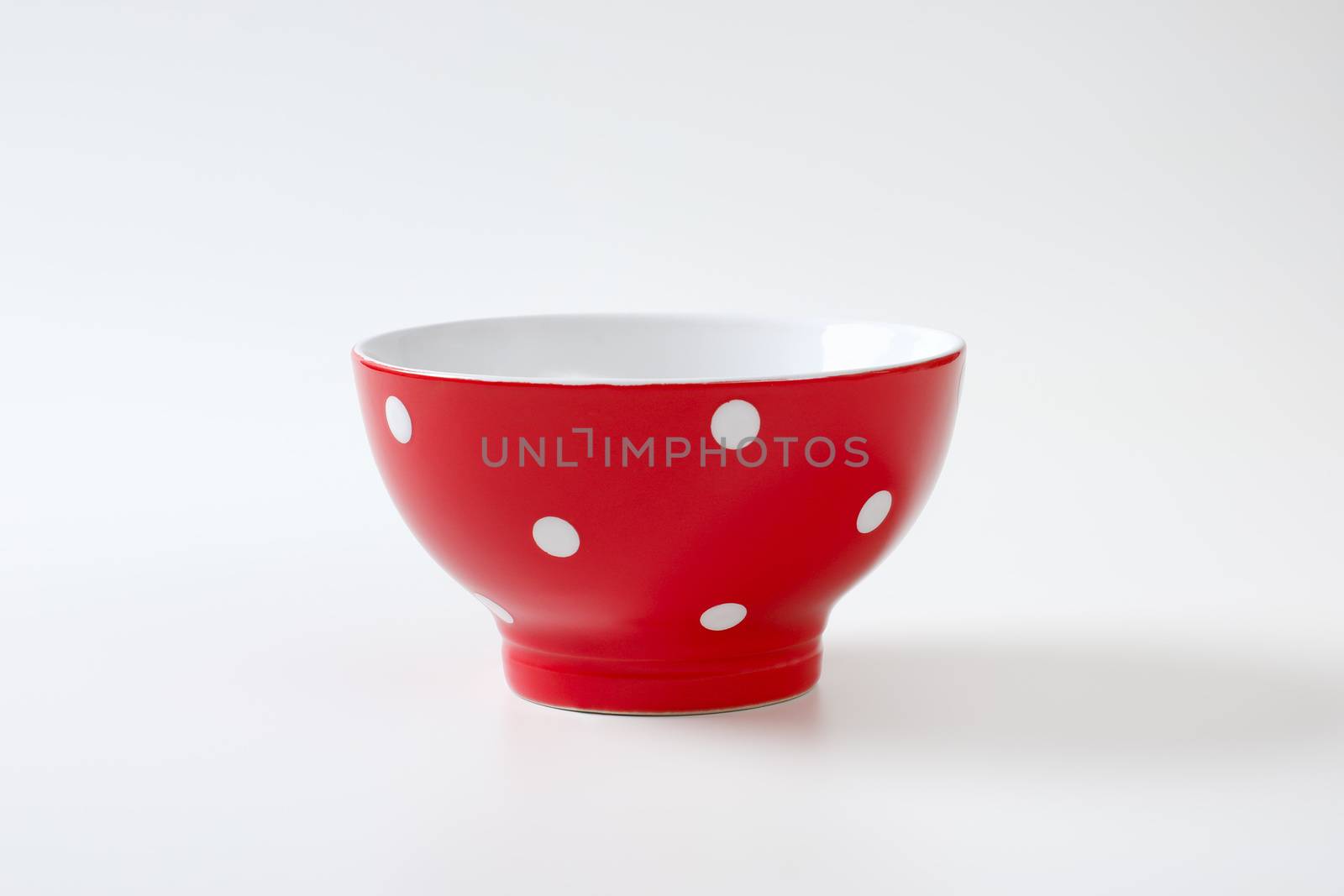 Empty red and white polka dot bowl by Digifoodstock