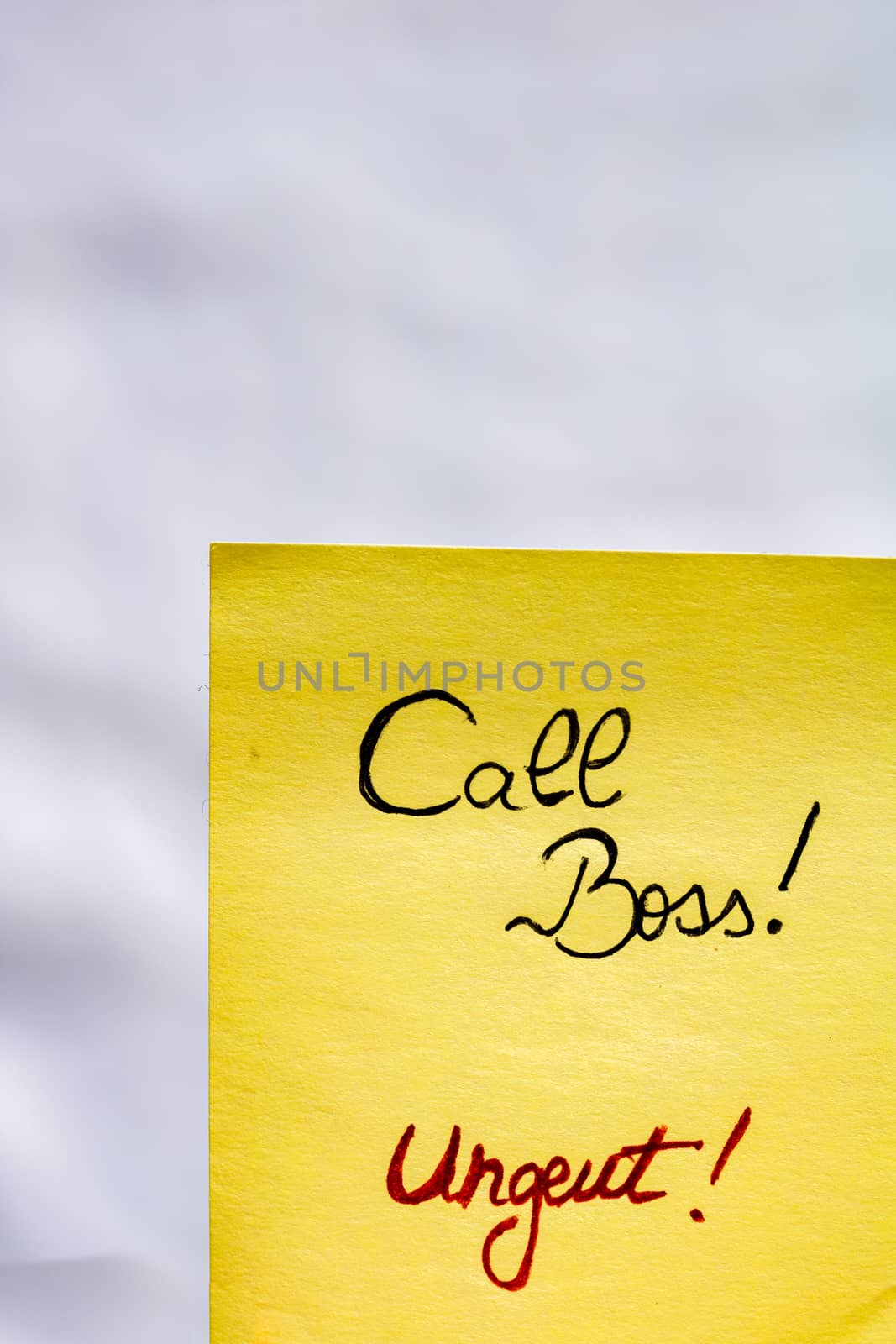 Call boss handwriting text close up isolated on yellow paper wit by vladispas