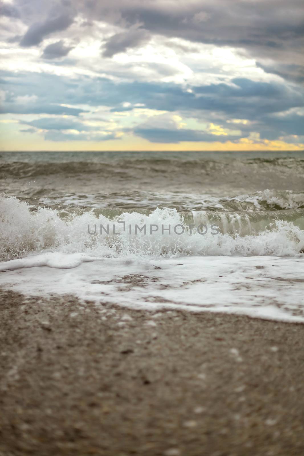 summer Sea or ocean cloudy sky, wave after storm with splash. Space for text.