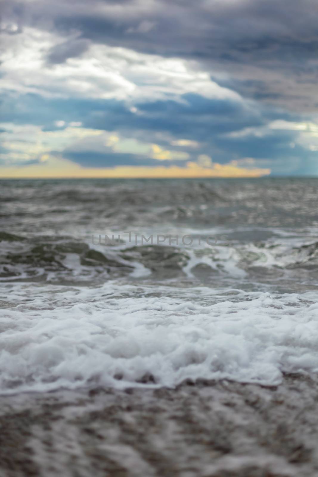 summer Sea or ocean cloudy sky, wave after storm with splash. Space for text.
