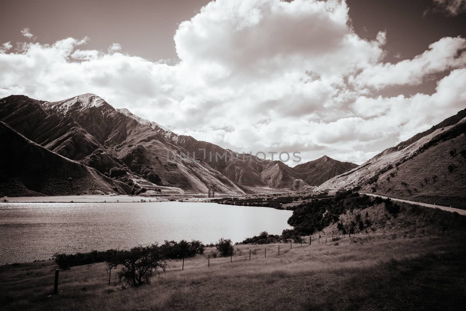 The stunning idyllic Moke Lake near Queenstown in Otago, New Zealand. This secluded, peaceful lake is a popular locale for camping, boating, hiking & horseback riding.