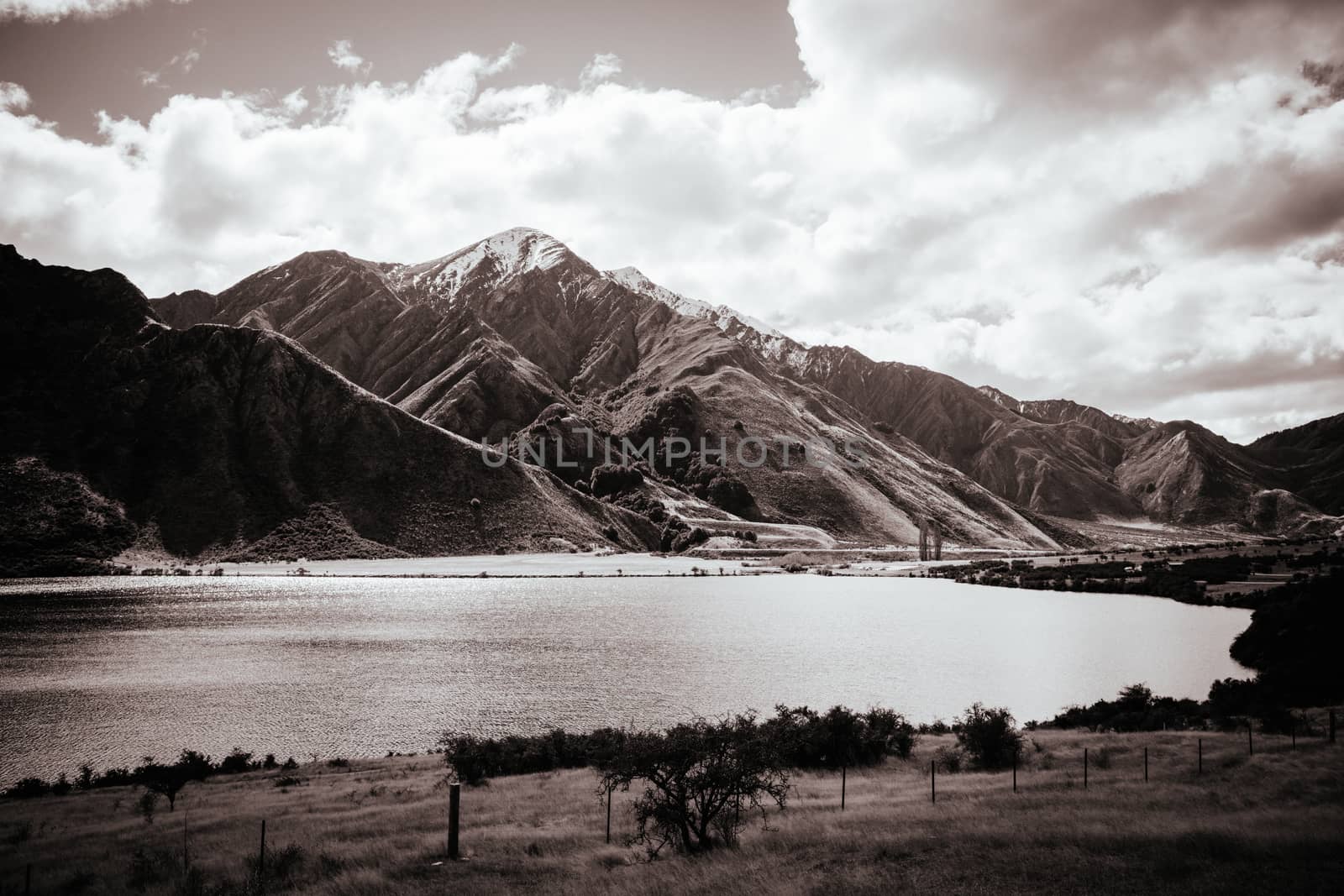 The stunning idyllic Moke Lake near Queenstown in Otago, New Zealand. This secluded, peaceful lake is a popular locale for camping, boating, hiking & horseback riding.