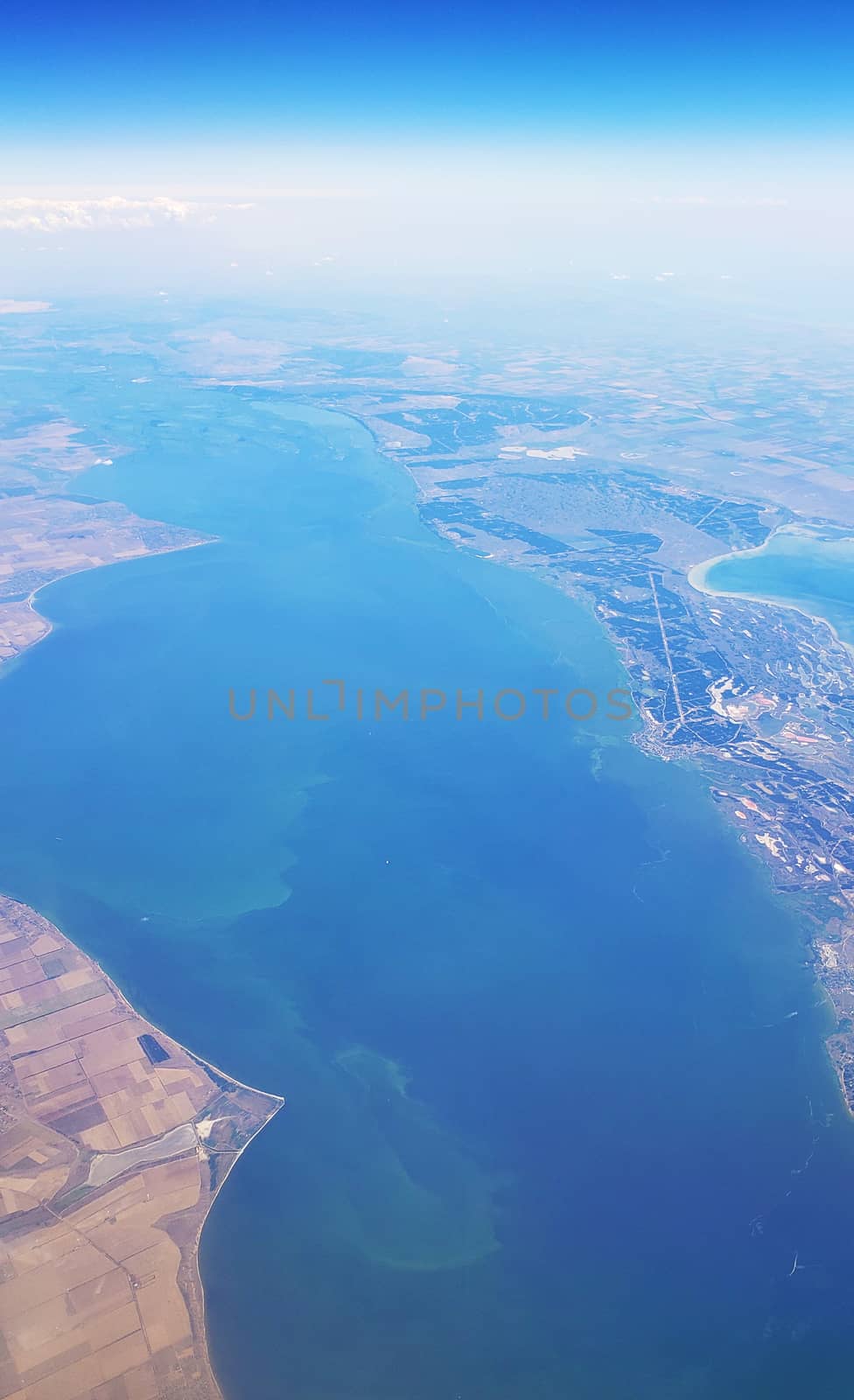 The view from the airplane window to the ground. Landscape view from the sky.