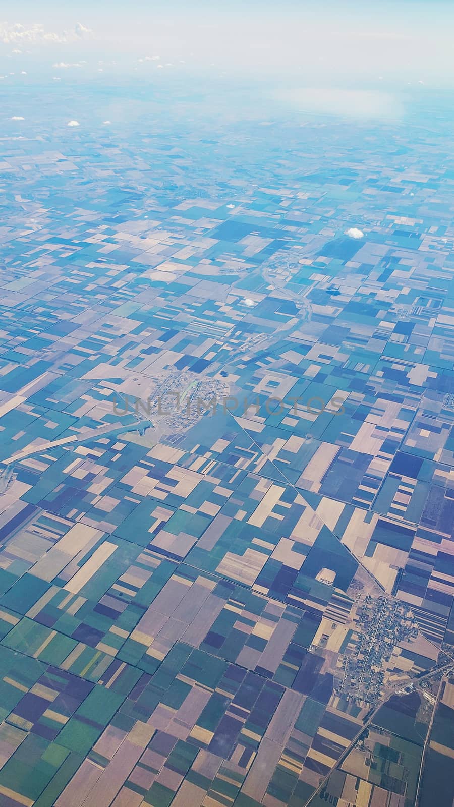 The view from the airplane window to the ground. Landscape view from the sky.