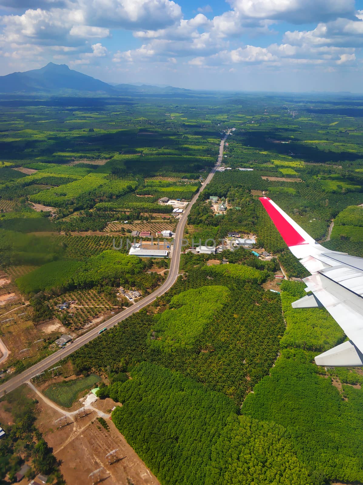 The view from the airplane window to the ground. Landscape view from the sky.