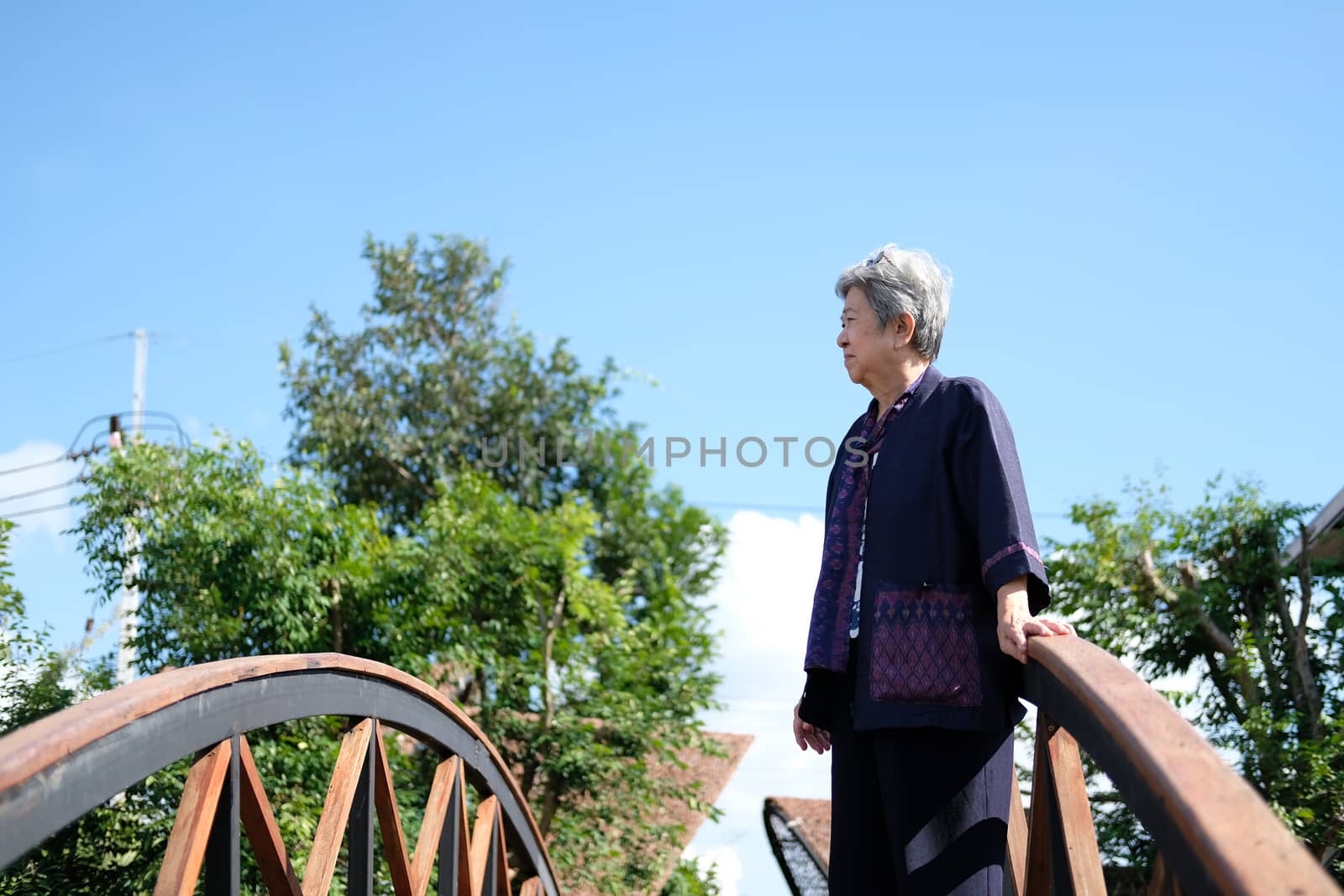 asian elderly woman elder  resting relaxing outdoors. senior leisure lifestyle